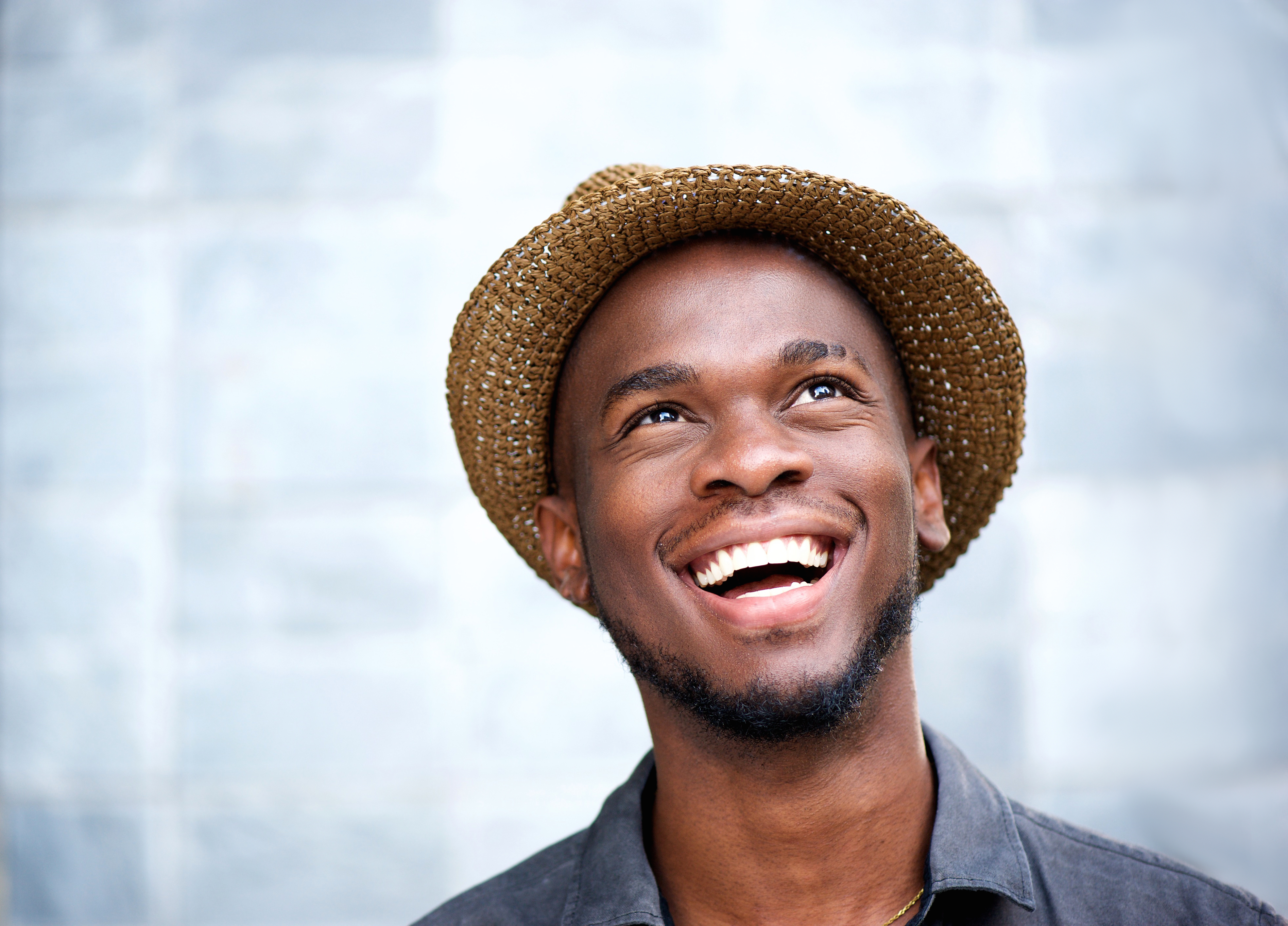 smiling guy straight teeth from orthodontist